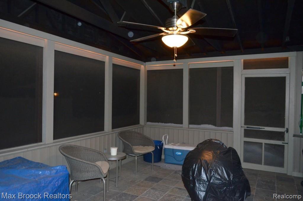 32045 Bonnet Hill Road Farmington, MI 48334 - Photo 17 of 17 3 Season Room Evening w Slate Flooring and Vaulted Ceiling