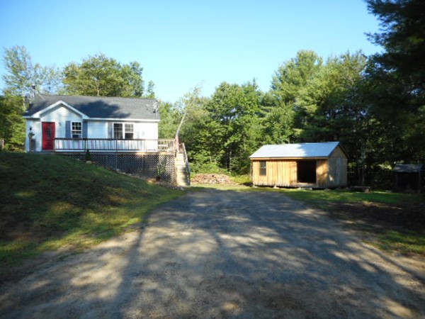 9 Murphy Road North Brookfield, MA 01535 - Photo 1 of 25 a front view of a house with a yard and trees