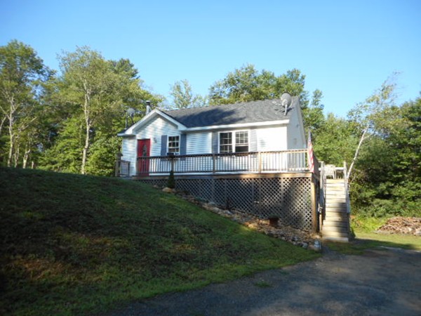 9 Murphy Road North Brookfield, MA 01535 - Photo 2 of 25 a front view of a house with a yard and lake view