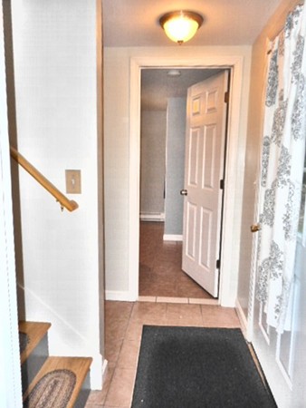 9 Murphy Road North Brookfield, MA 01535 - Photo 23 of 25 a view of a hallway with wooden floor and cabinet