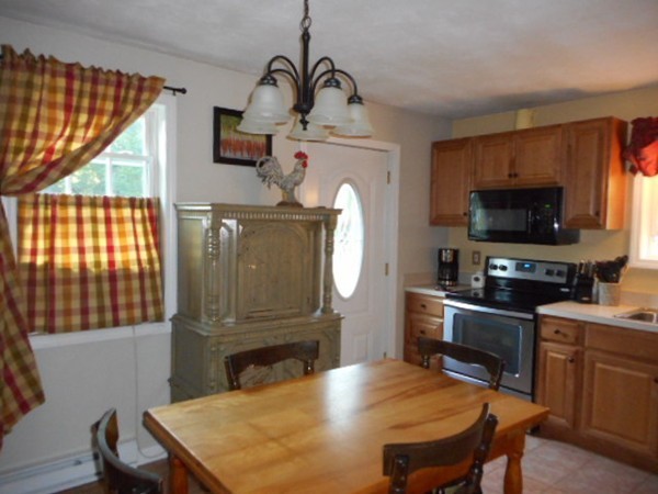 9 Murphy Road North Brookfield, MA 01535 - Photo 5 of 25 a living room with furniture a fireplace and a flat screen tv
