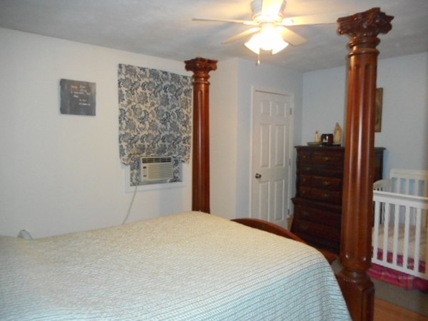 9 Murphy Road North Brookfield, MA 01535 - Photo 7 of 25 a bedroom with a bed and a chandelier