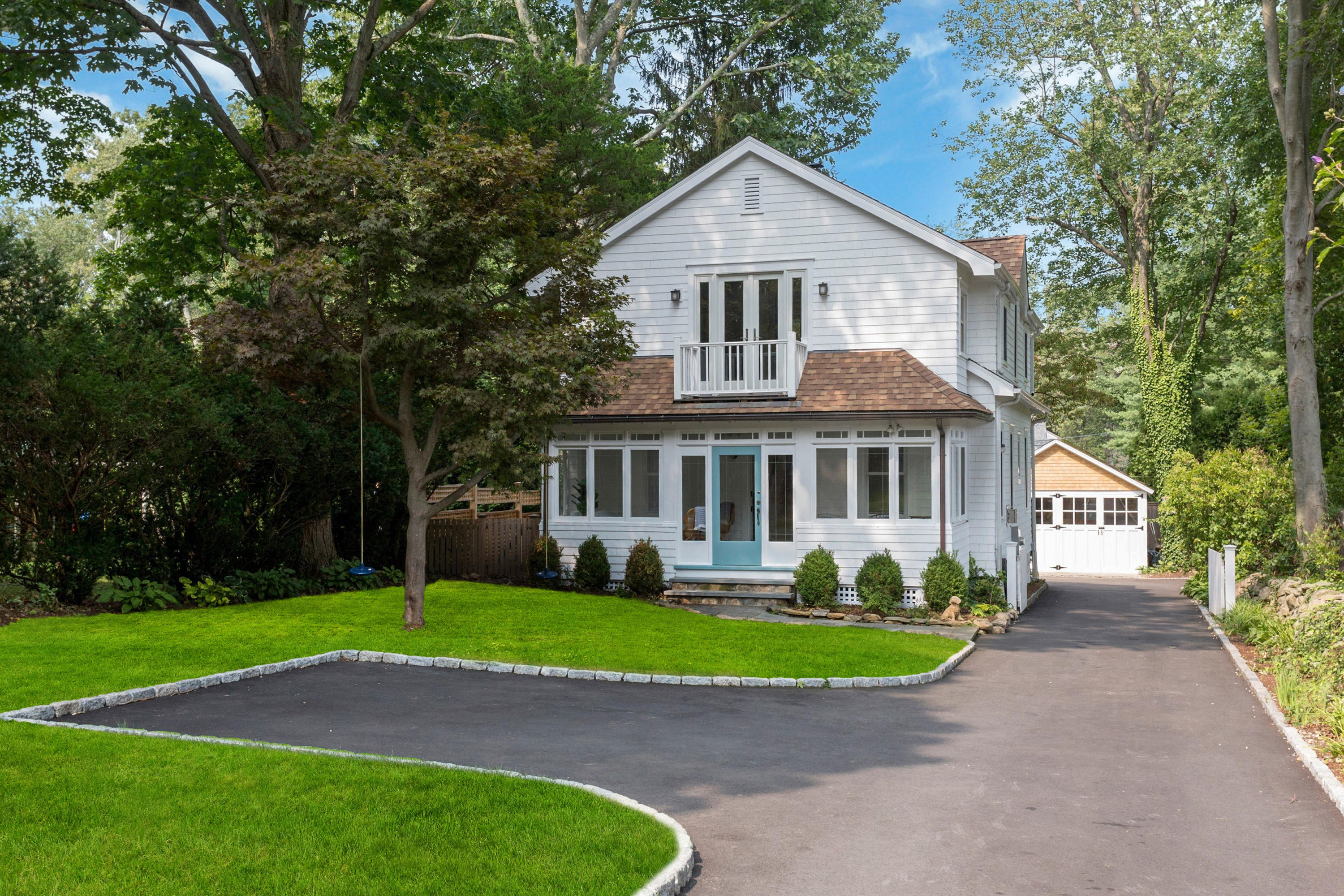 227 Middlesex Road Darien, CT 06820 - Photo 1 of 30 a front view of a house with a garden and trees