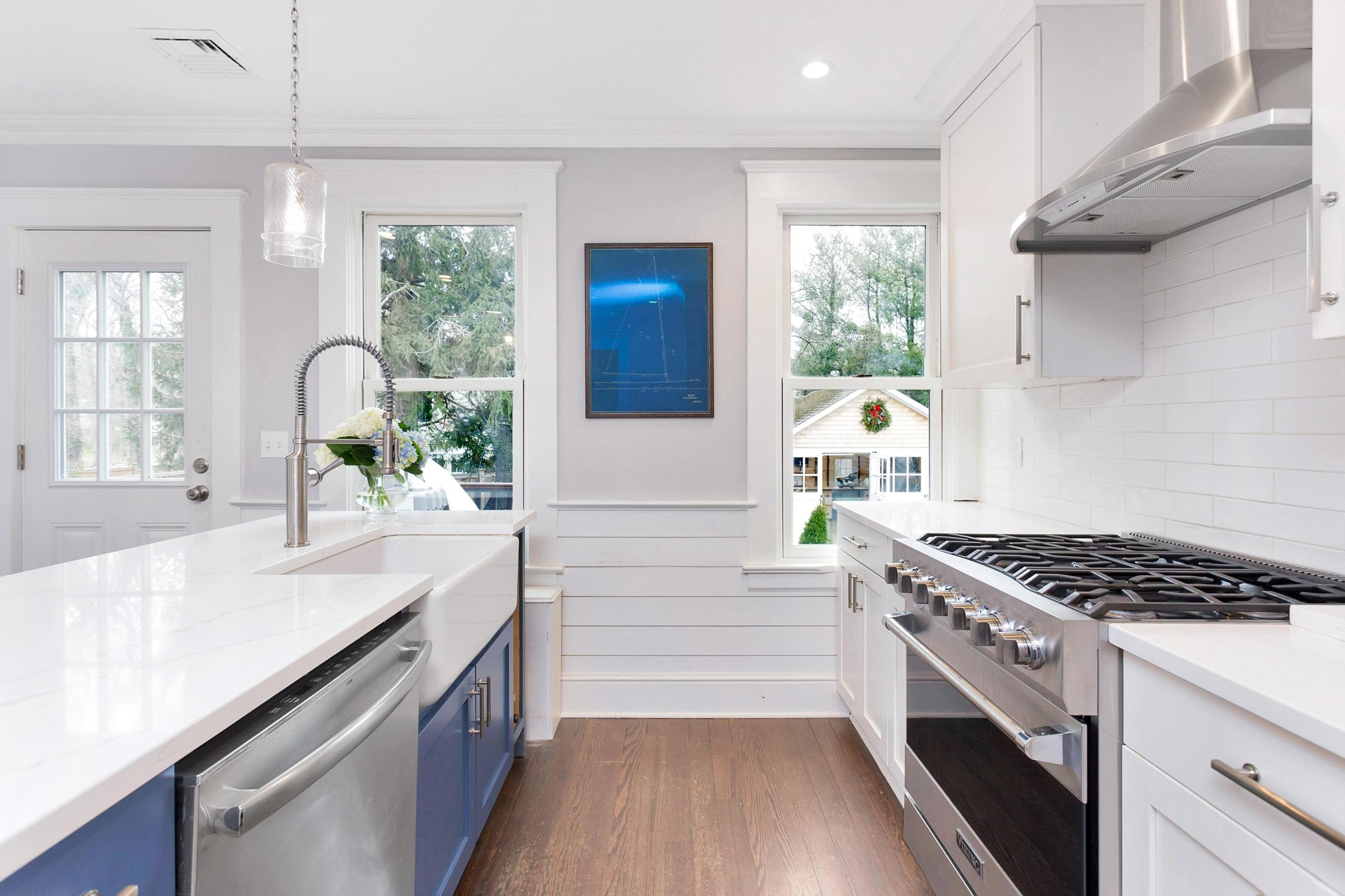 227 Middlesex Road Darien, CT 06820 - Photo 11 of 30 a kitchen with granite countertop a stove a sink and wooden floors