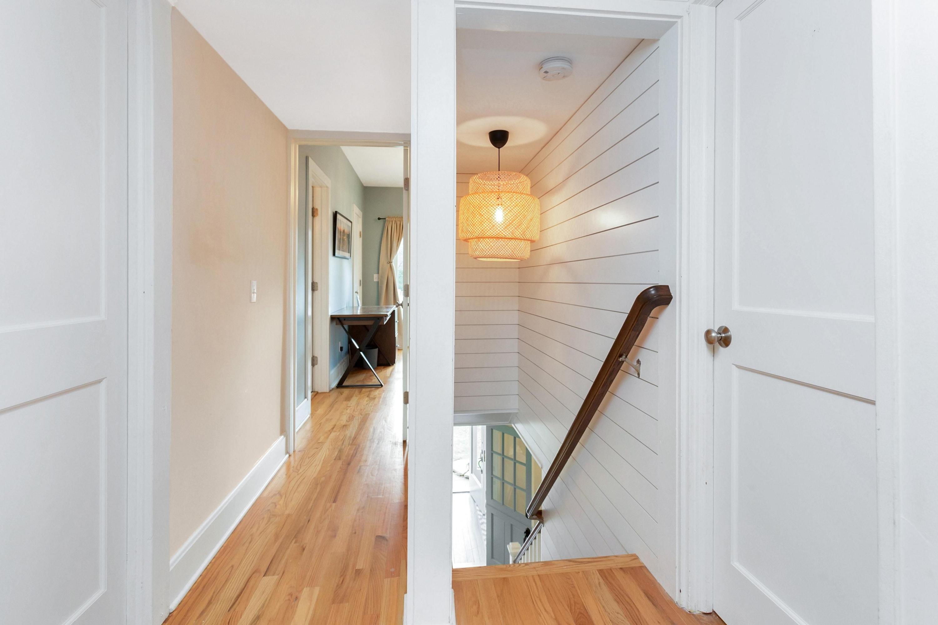 227 Middlesex Road Darien, CT 06820 - Photo 15 of 30 a view of a hallway with wooden floor and staircase