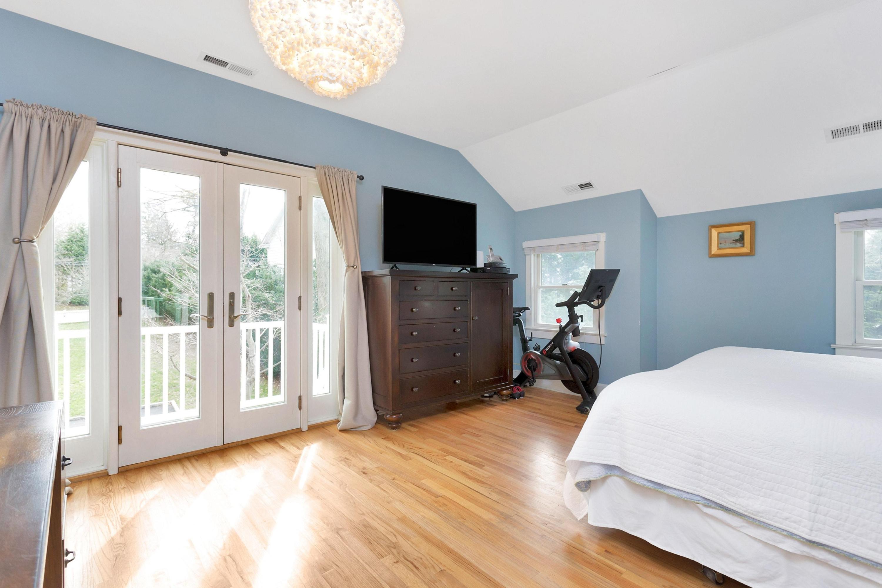 227 Middlesex Road Darien, CT 06820 - Photo 16 of 30 a bedroom with a bed and tv