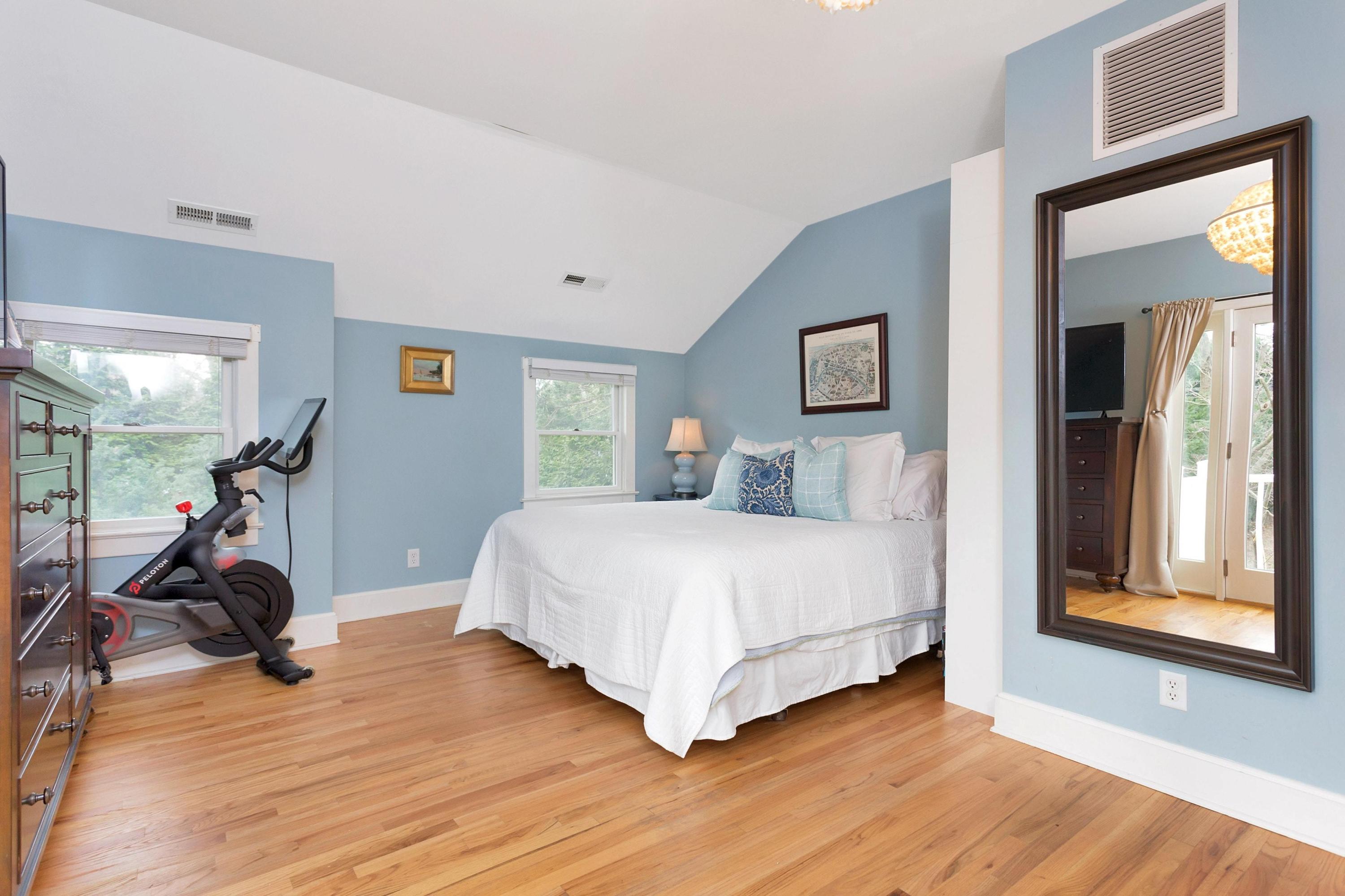 227 Middlesex Road Darien, CT 06820 - Photo 18 of 30 a bedroom with a bed and a large mirror