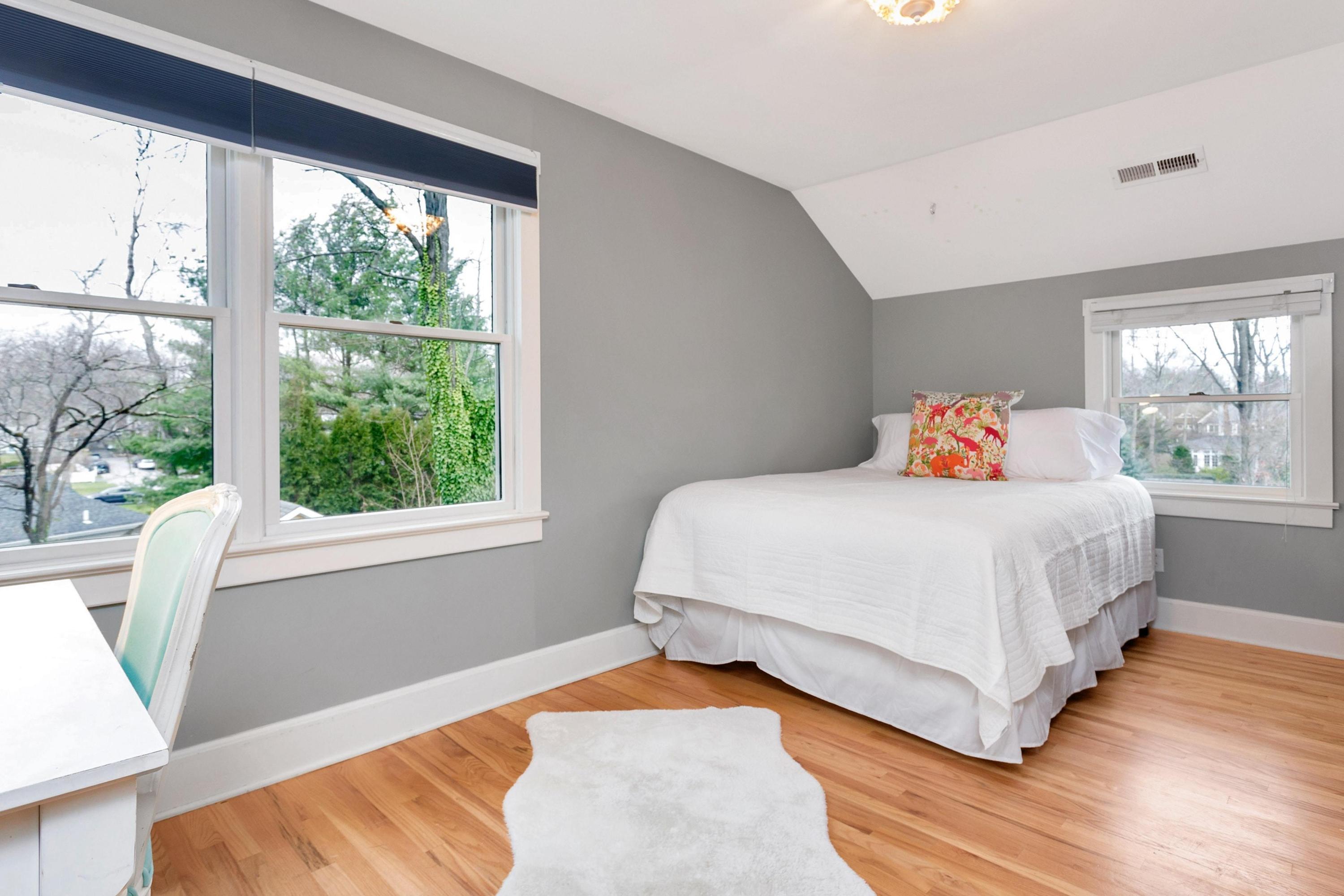 227 Middlesex Road Darien, CT 06820 - Photo 20 of 30 a bedroom with a bed and wooden floor