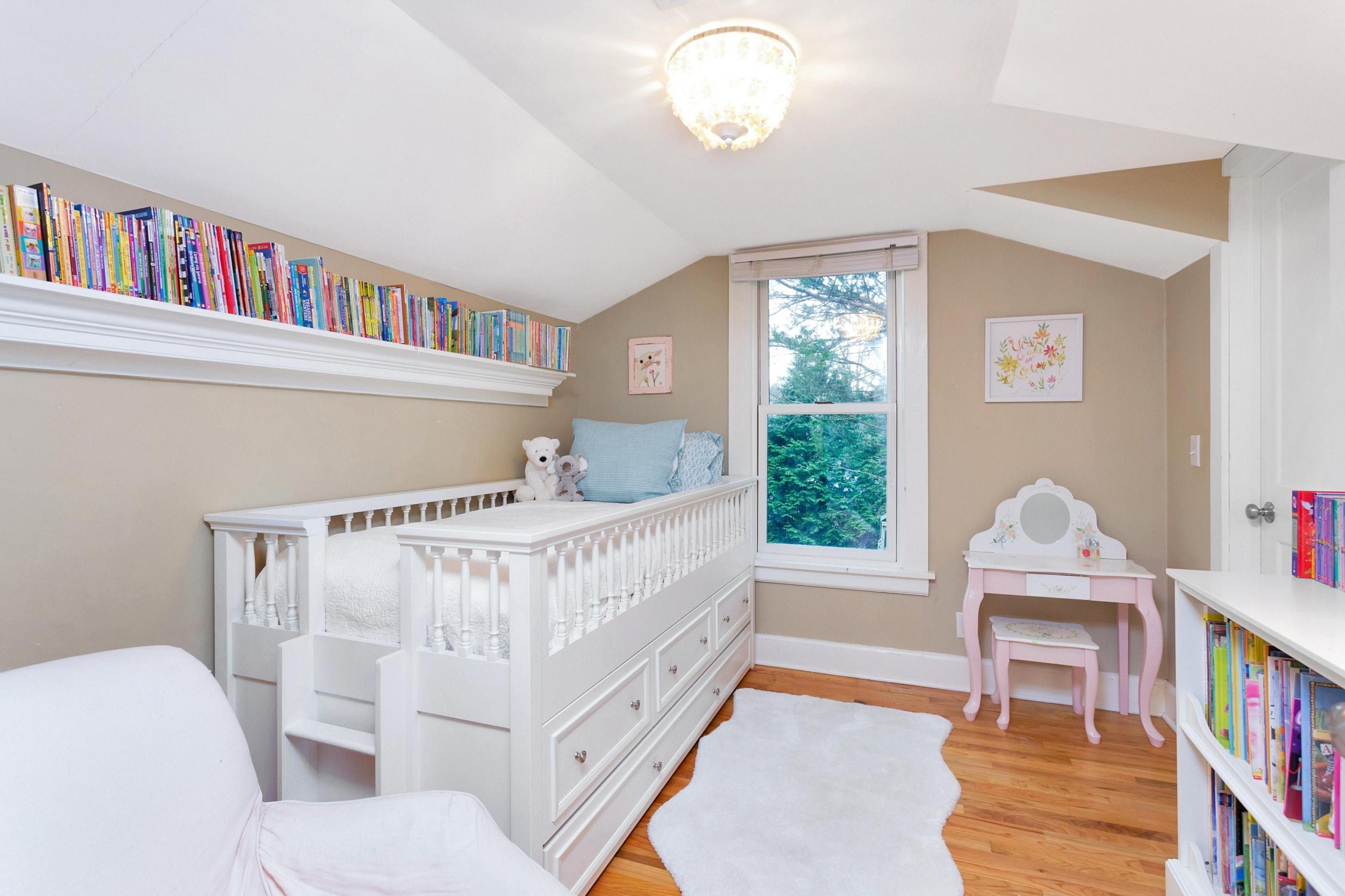 227 Middlesex Road Darien, CT 06820 - Photo 22 of 30 a view of a bedroom with furniture window and wooden floor
