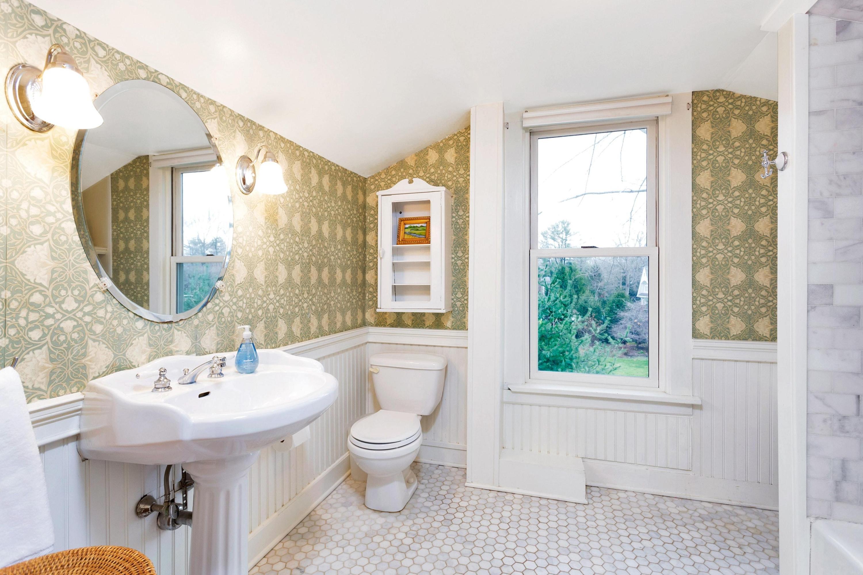 227 Middlesex Road Darien, CT 06820 - Photo 23 of 30 a bathroom with a sink toilet a mirror and tub