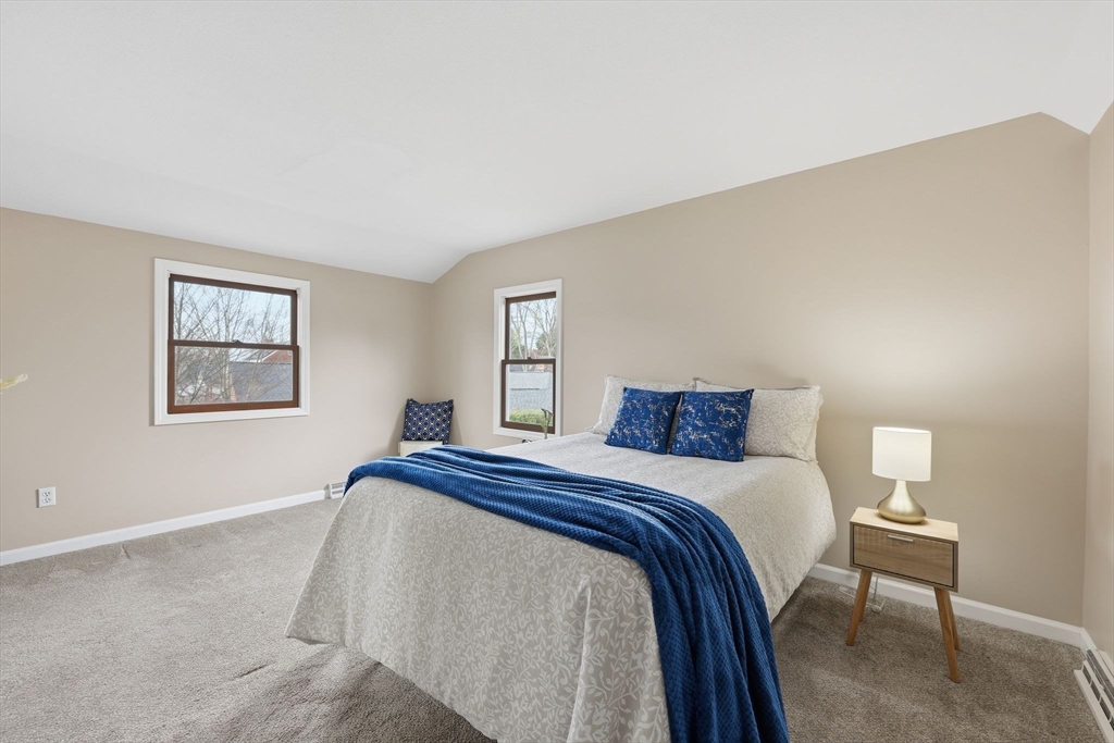 10 Woodcrest Road Springfield, MA 01129 - Photo 18 of 26 a bedroom with a bed and a lamp