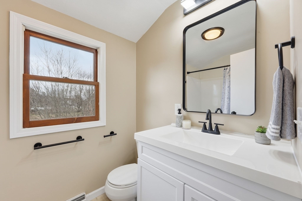 10 Woodcrest Road Springfield, MA 01129 - Photo 20 of 26 a bathroom with a toilet sink and mirror
