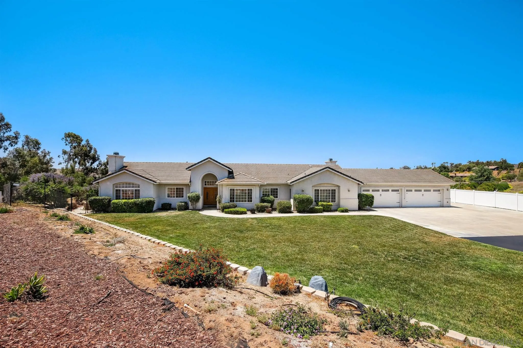 31210 Rivoli Road Valley Center, CA 92082 - Photo 1 of 62 a front view of a house with a yard
