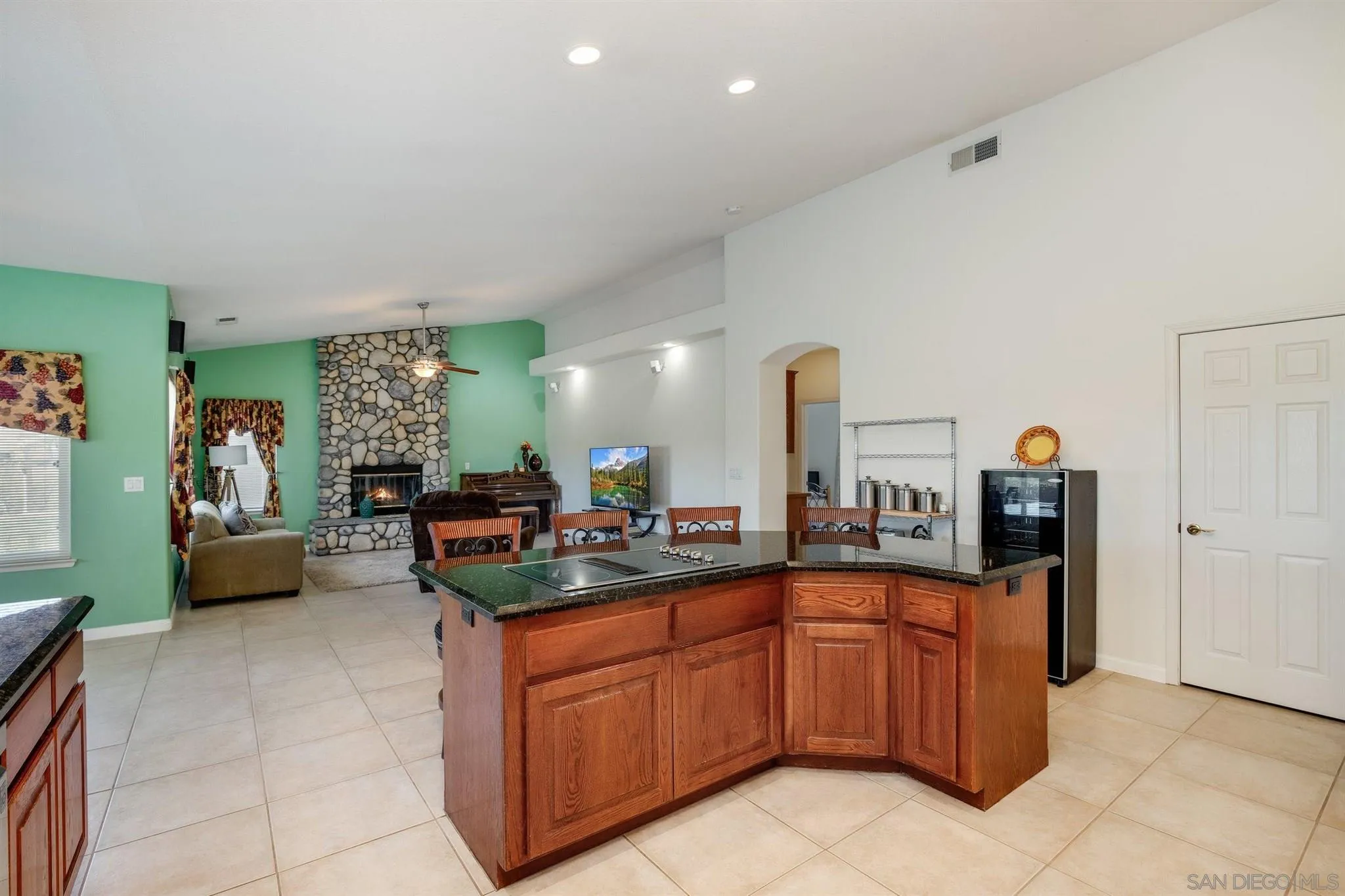 31210 Rivoli Road Valley Center, CA 92082 - Photo 13 of 62 a kitchen with stainless steel appliances granite countertop a sink and cabinets