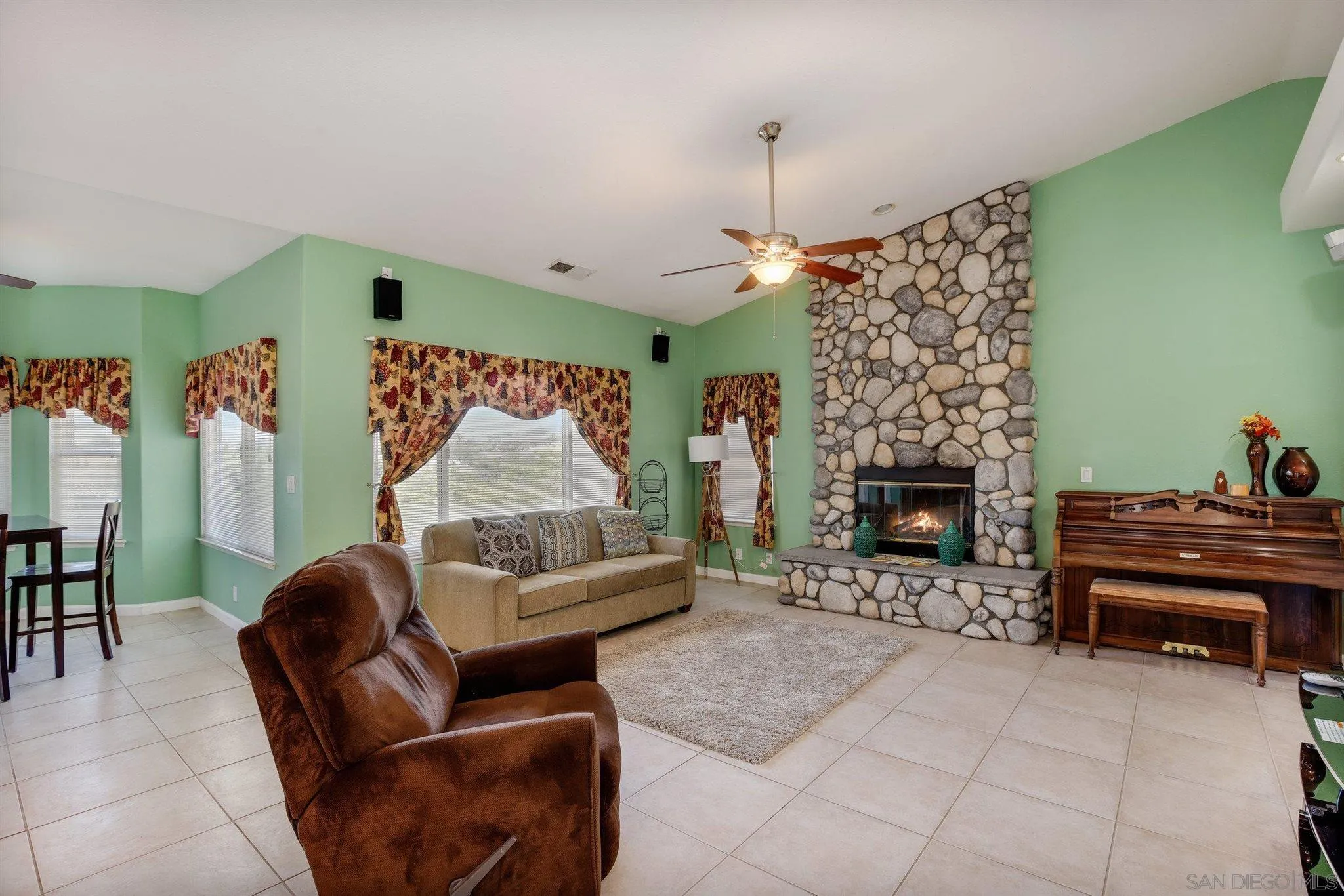31210 Rivoli Road Valley Center, CA 92082 - Photo 17 of 62 a living room with furniture and a fireplace