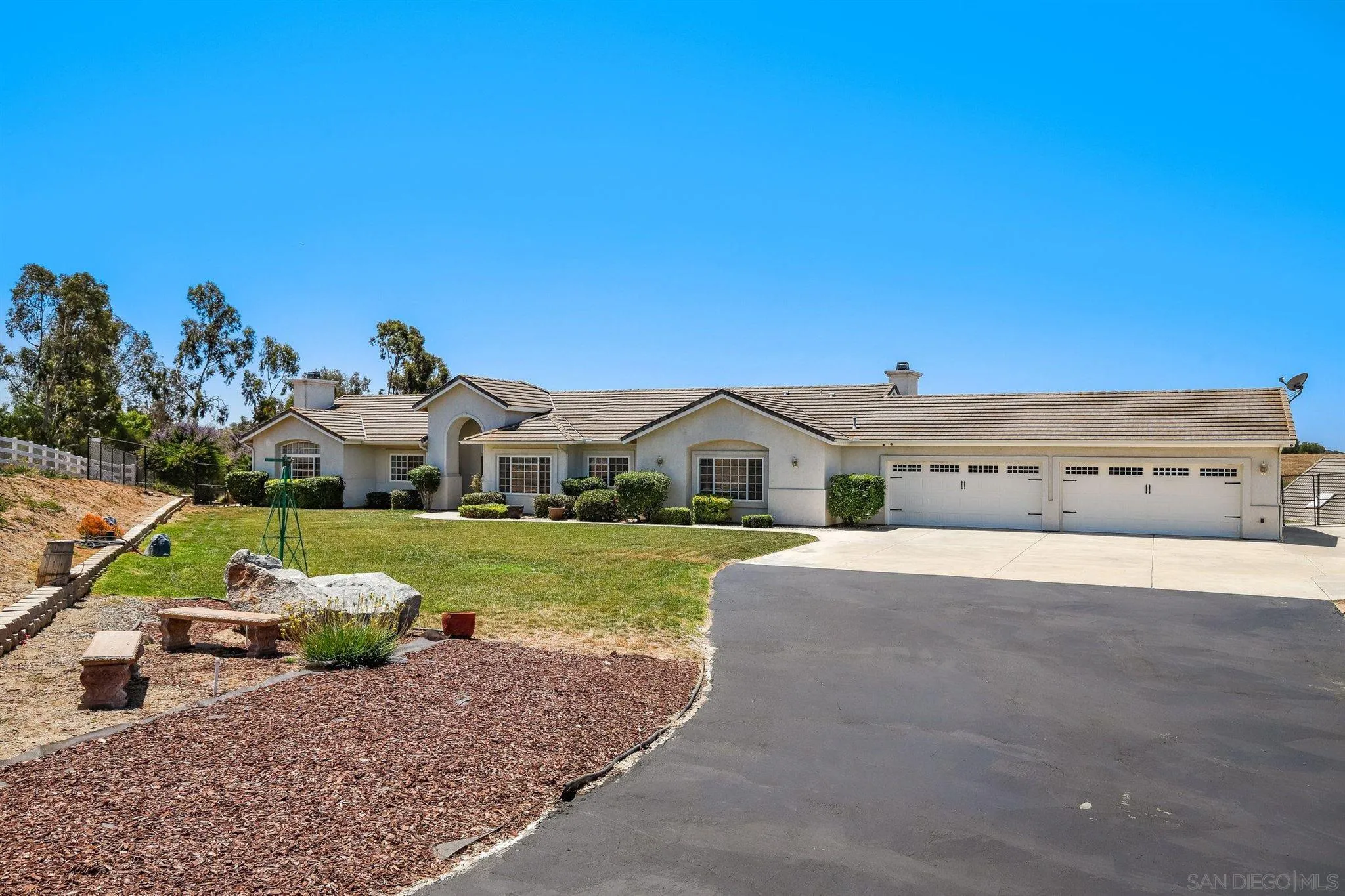 31210 Rivoli Road Valley Center, CA 92082 - Photo 2 of 62 a front view of a house with a yard