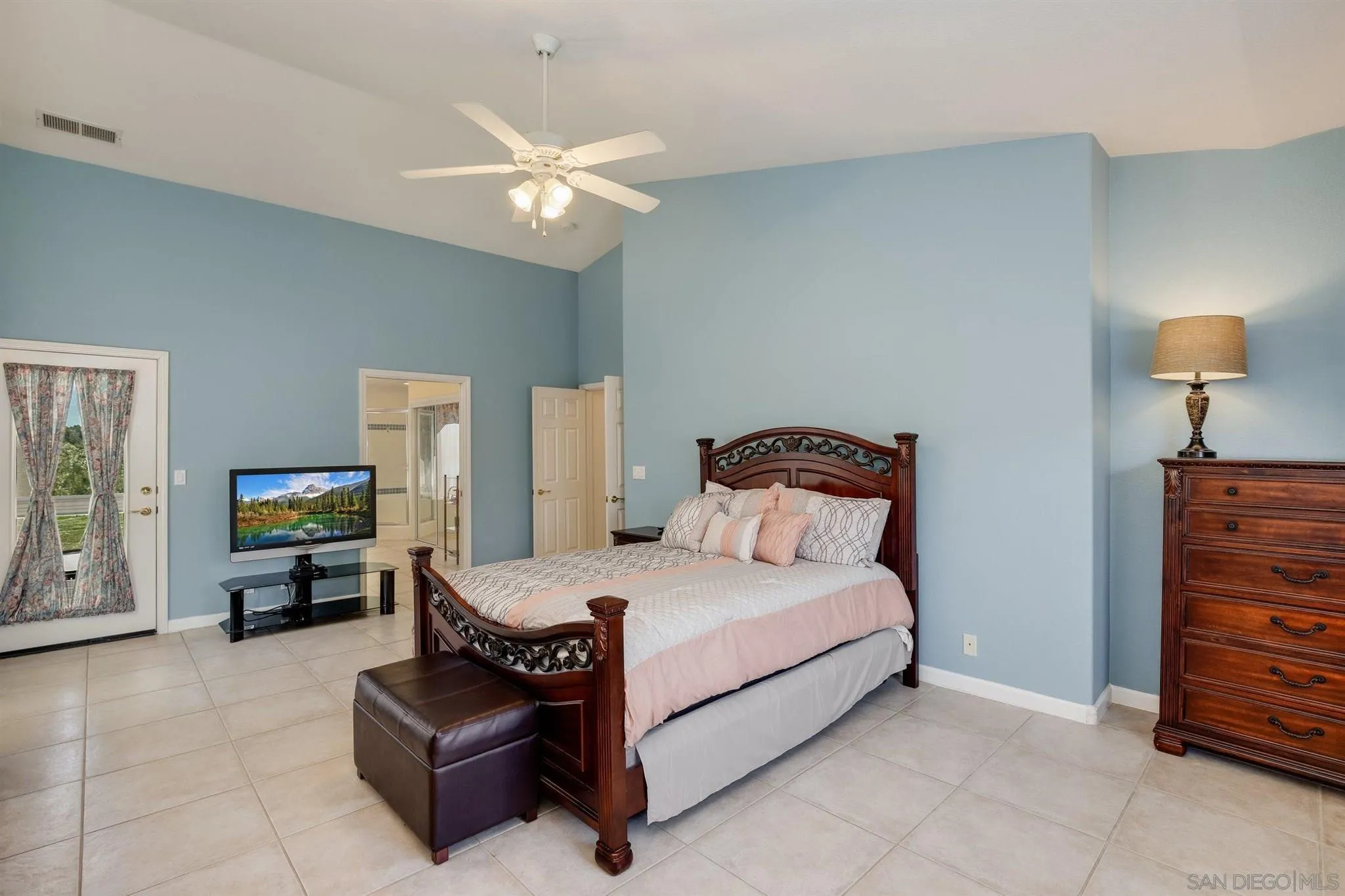 31210 Rivoli Road Valley Center, CA 92082 - Photo 22 of 62 a bedroom with a bed and furniture