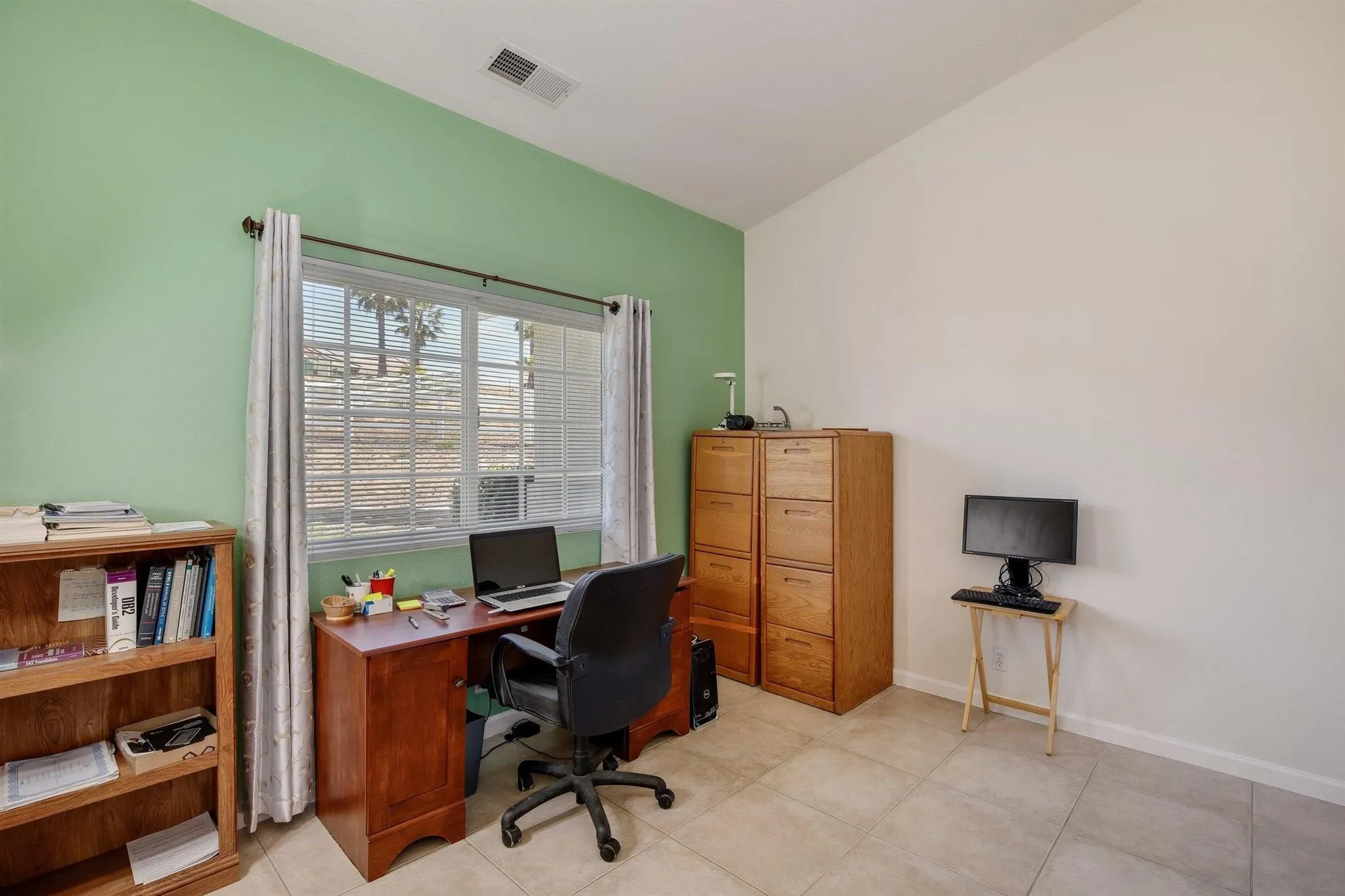 31210 Rivoli Road Valley Center, CA 92082 - Photo 26 of 62 a view of a workspace with furniture and a window