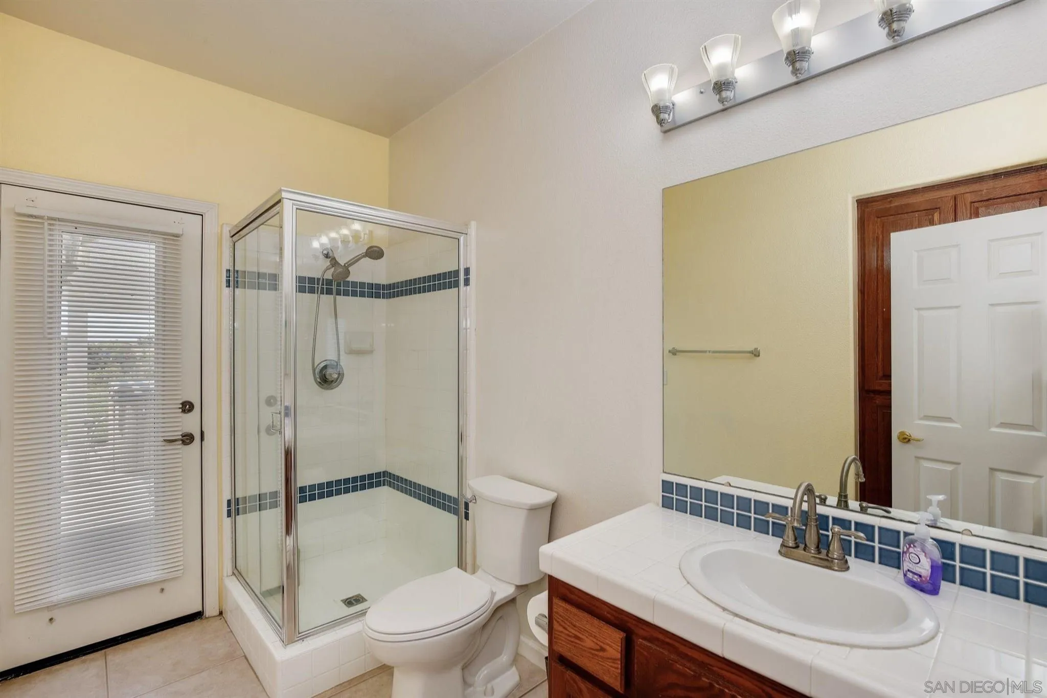 31210 Rivoli Road Valley Center, CA 92082 - Photo 27 of 62 a bathroom with a sink a toilet and shower