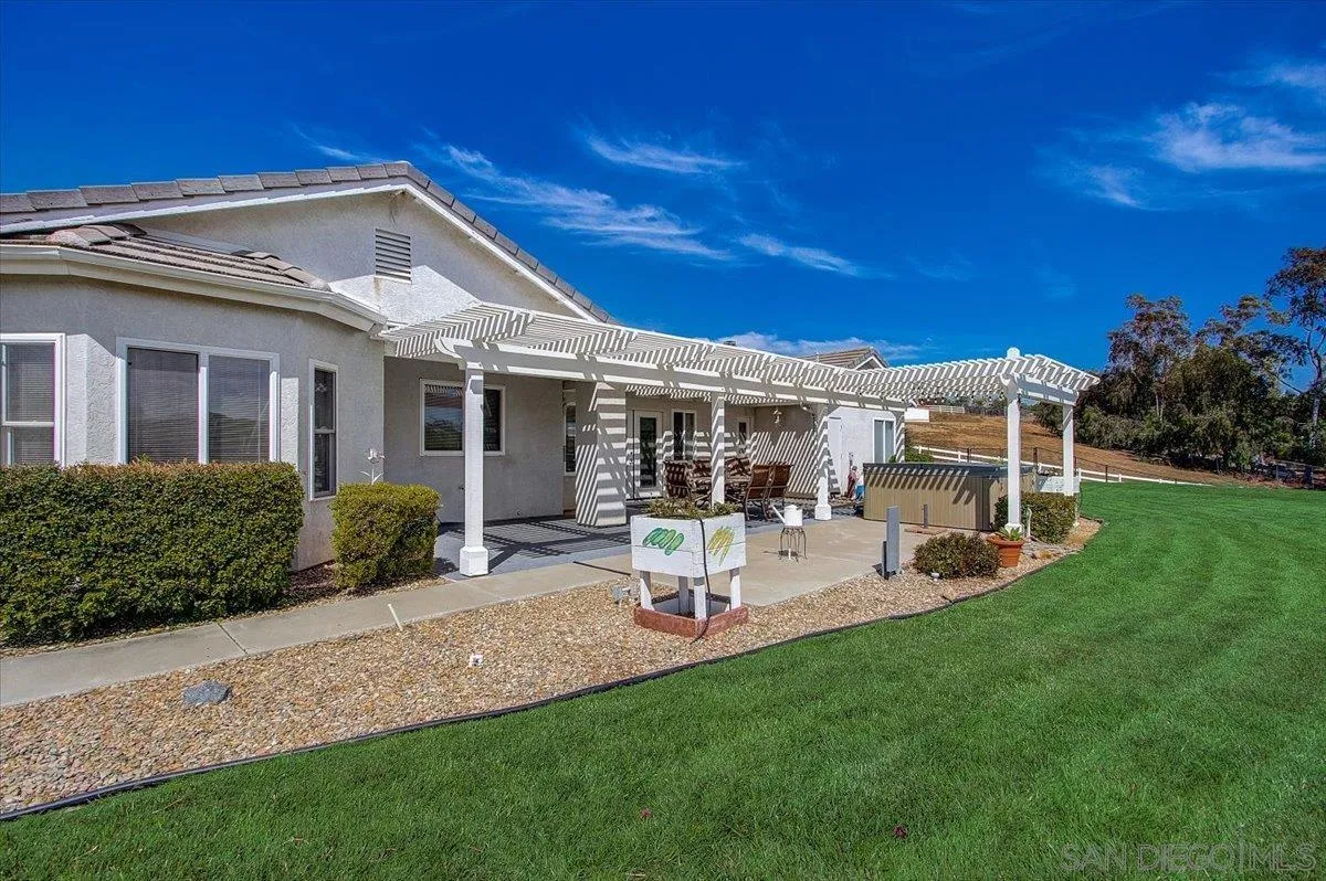 31210 Rivoli Road Valley Center, CA 92082 - Photo 33 of 62 a view of a house with backyard sitting area and garden