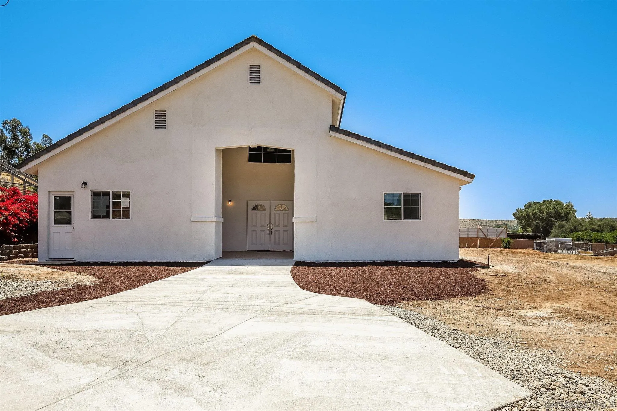 31210 Rivoli Road Valley Center, CA 92082 - Photo 40 of 62 a view of a house with a yard