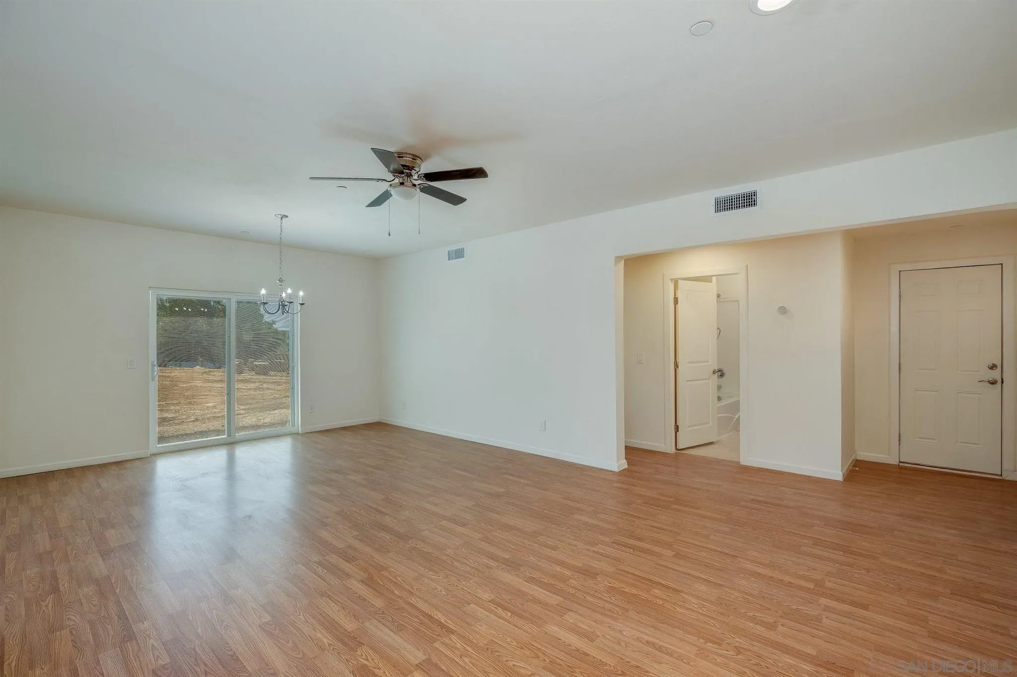 31210 Rivoli Road Valley Center, CA 92082 - Photo 45 of 62 a view of an empty room with wooden floor