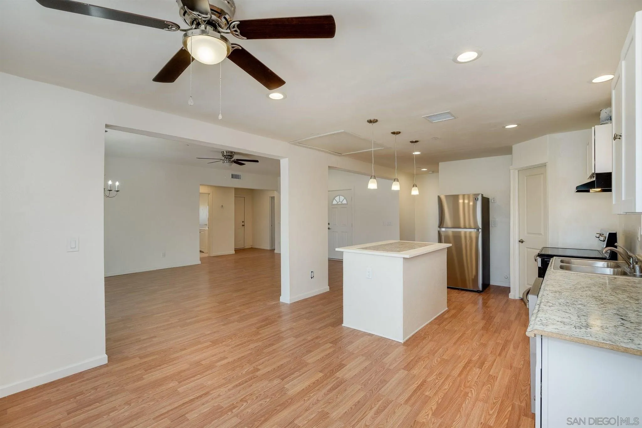 31210 Rivoli Road Valley Center, CA 92082 - Photo 49 of 62 a view of a kitchen with a sink and a refrigerator