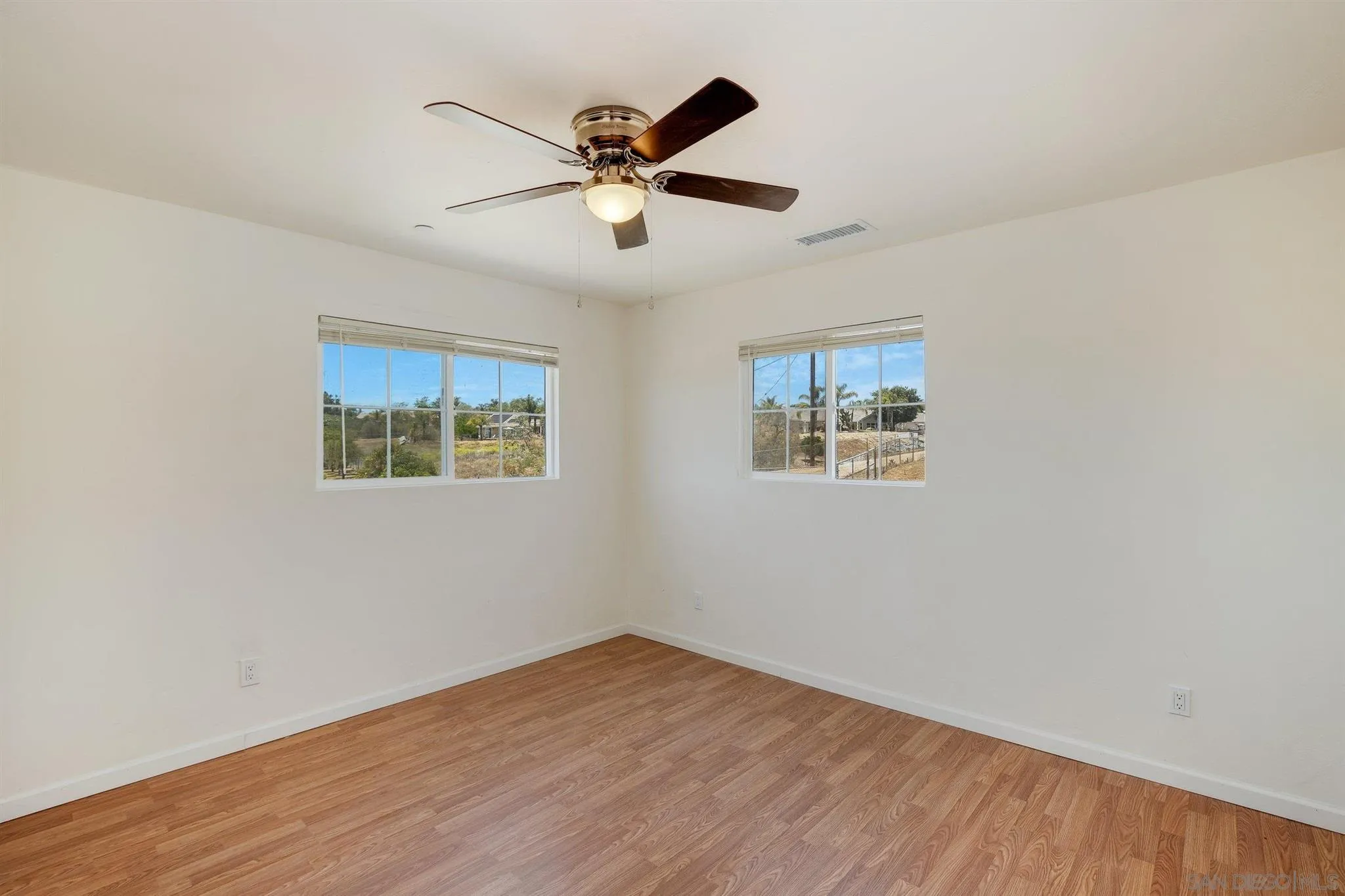 31210 Rivoli Road Valley Center, CA 92082 - Photo 53 of 62 a view of empty room with wooden floor