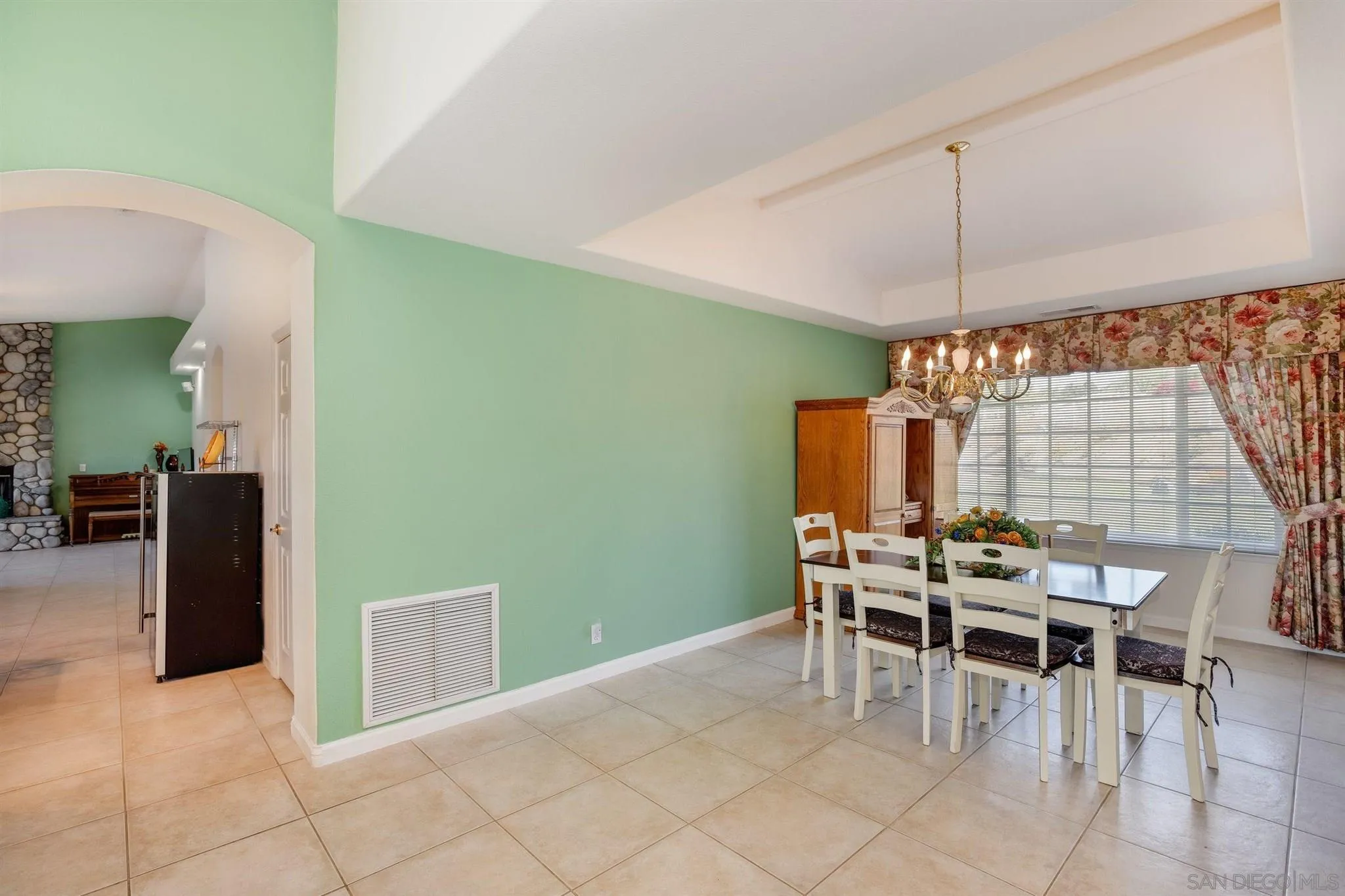 31210 Rivoli Road Valley Center, CA 92082 - Photo 8 of 62 a view of a dining room with furniture and chandelier