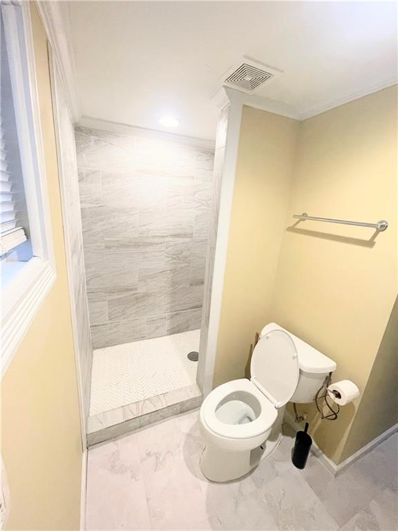 814 Moreland Avenue Southeast Atlanta, GA 30316 - Photo 12 of 15 a white toilet sitting next to a bathroom sink and a tub