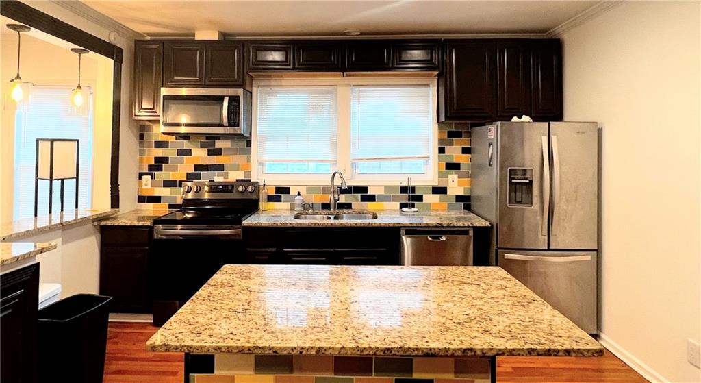 814 Moreland Avenue Southeast Atlanta, GA 30316 - Photo 2 of 15 a kitchen with a refrigerator and a stove top oven