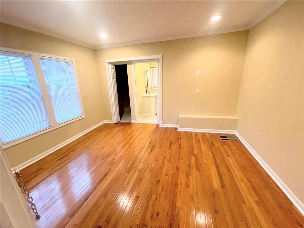 814 Moreland Avenue Southeast Atlanta, GA 30316 - Photo 7 of 15 a view of a room with wooden floor and brick walls