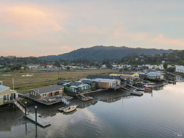 a view of a lake with multiple houses