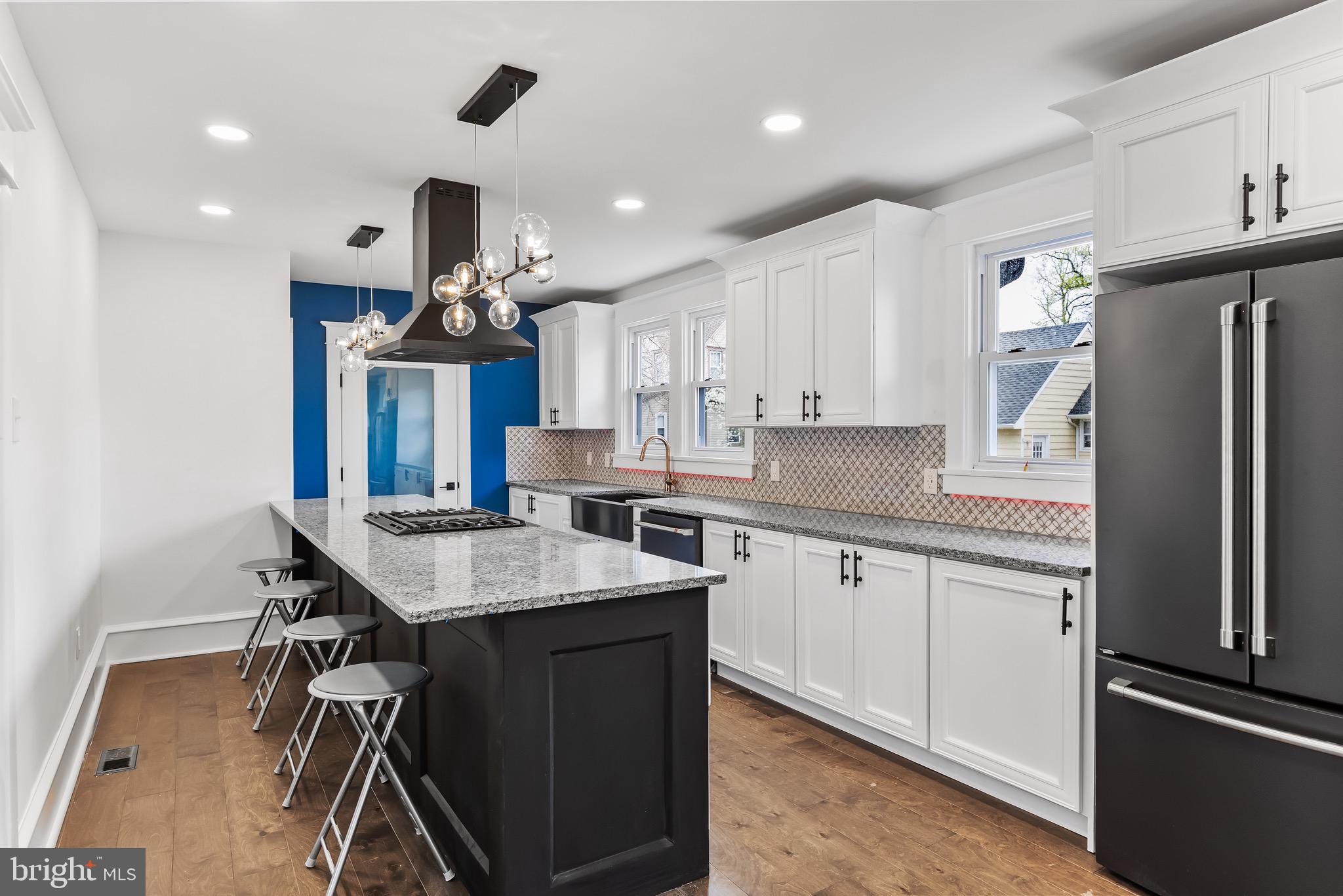 1013 Stone Road Laurel Springs, NJ 08021 - Photo 12 of 42 a kitchen with stainless steel appliances granite countertop a refrigerator a sink dishwasher a stove and a refrigerator with wooden floor