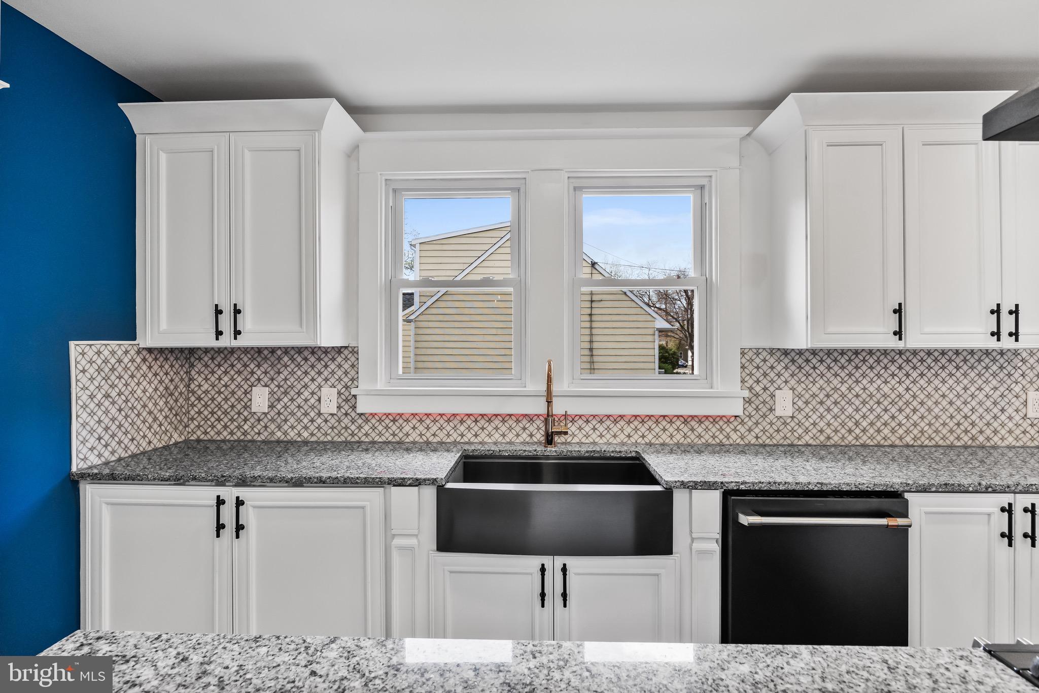 1013 Stone Road Laurel Springs, NJ 08021 - Photo 13 of 42 a kitchen with granite countertop a sink and a stove