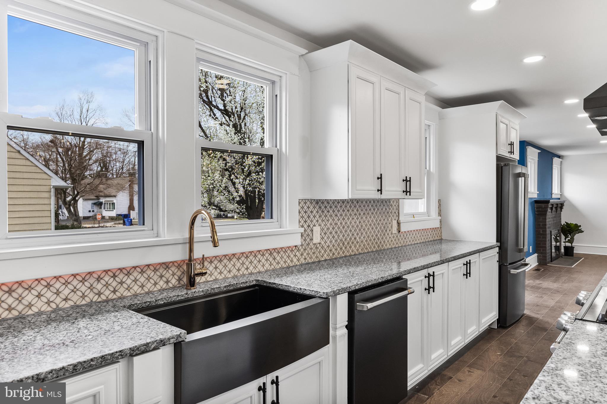 1013 Stone Road Laurel Springs, NJ 08021 - Photo 15 of 42 a kitchen with granite countertop a sink and a stove