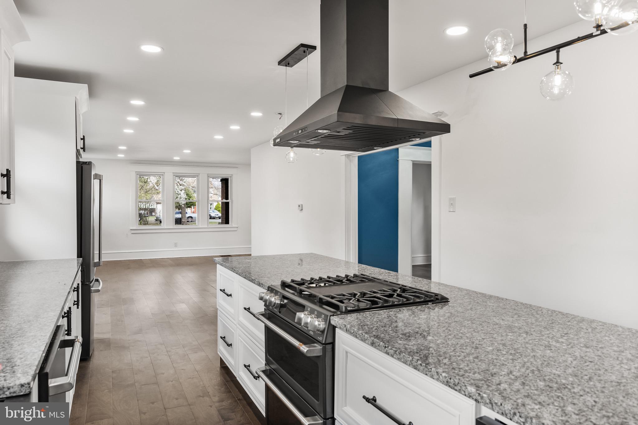 1013 Stone Road Laurel Springs, NJ 08021 - Photo 16 of 42 a kitchen with stainless steel appliances granite countertop a stove and a refrigerator
