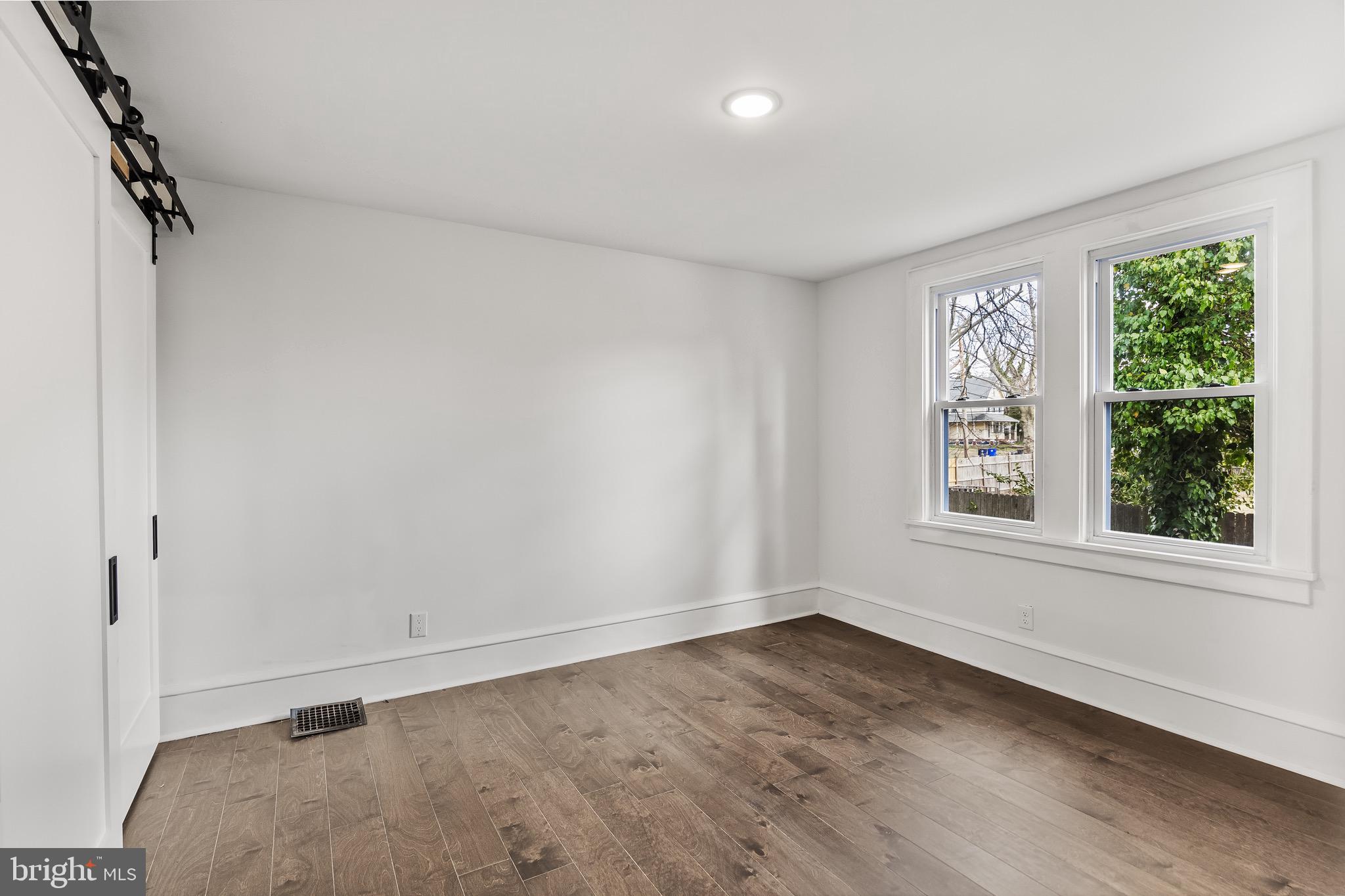 1013 Stone Road Laurel Springs, NJ 08021 - Photo 20 of 42 wooden floor in an empty room with a window