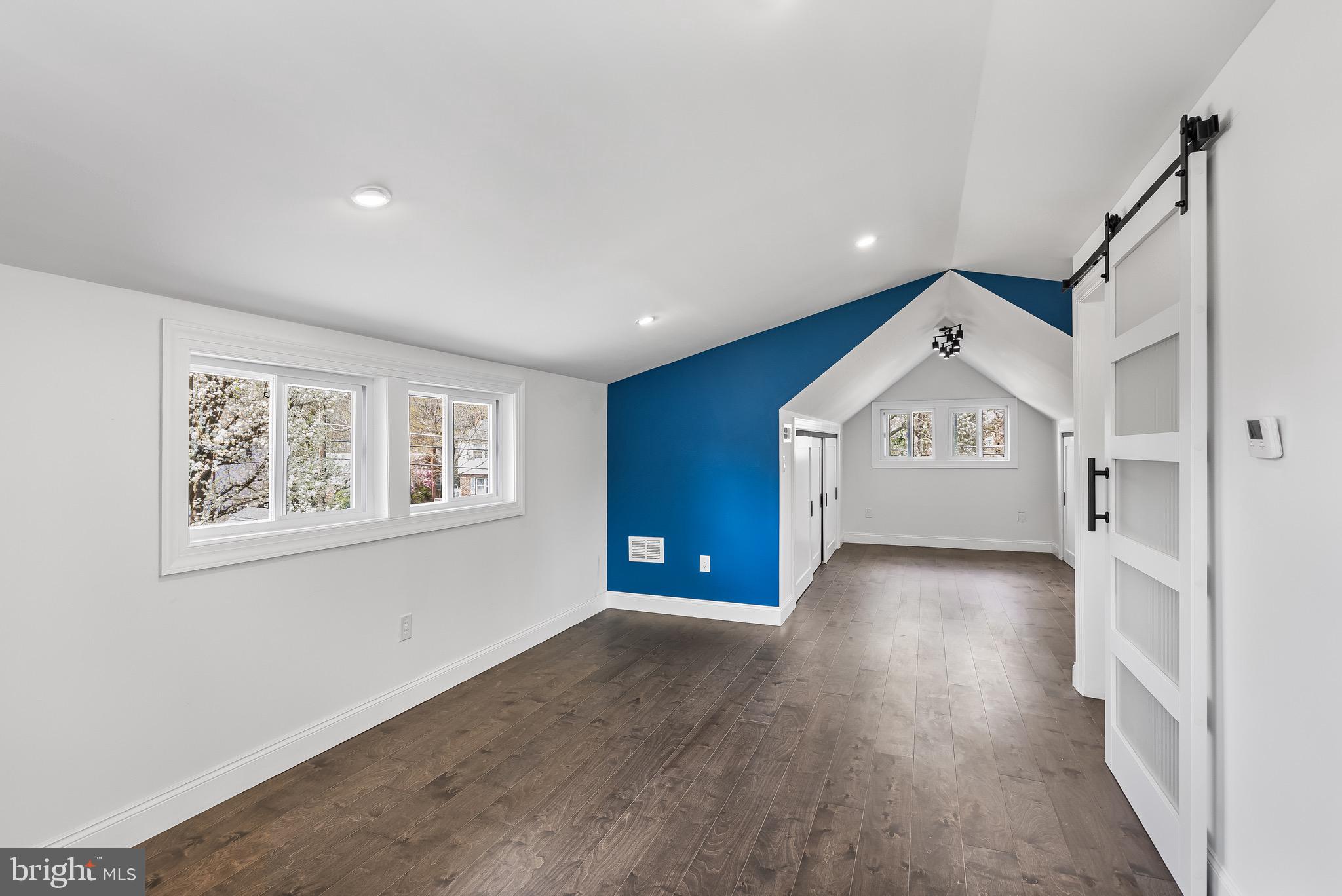 1013 Stone Road Laurel Springs, NJ 08021 - Photo 25 of 42 a view of a hallway with wooden floor and windows