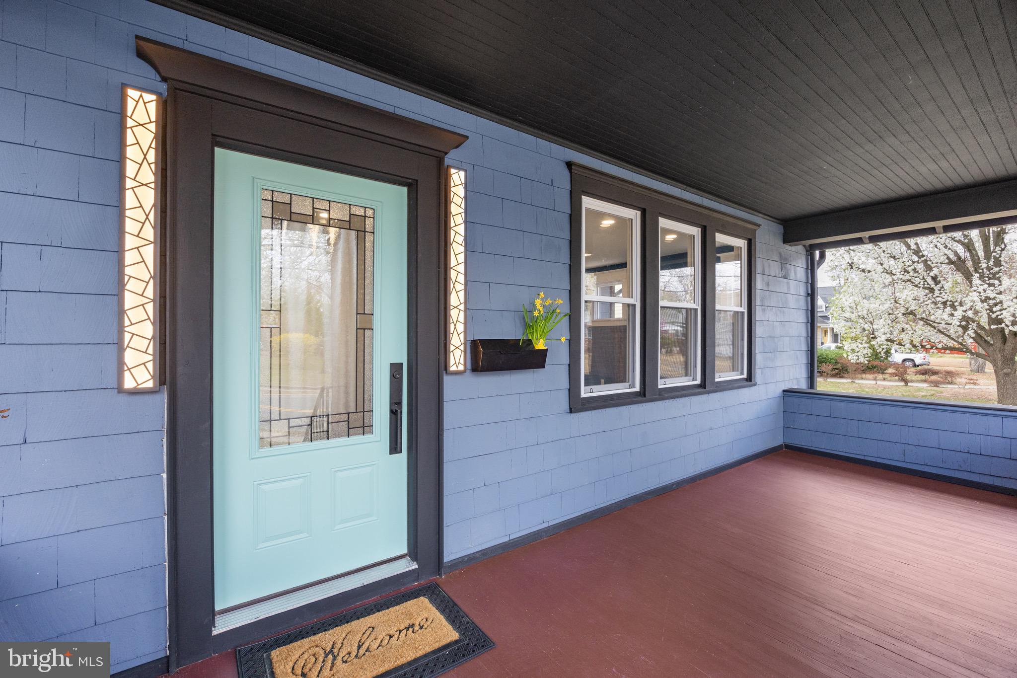1013 Stone Road Laurel Springs, NJ 08021 - Photo 5 of 42 a view of an empty room with wooden floor and a window