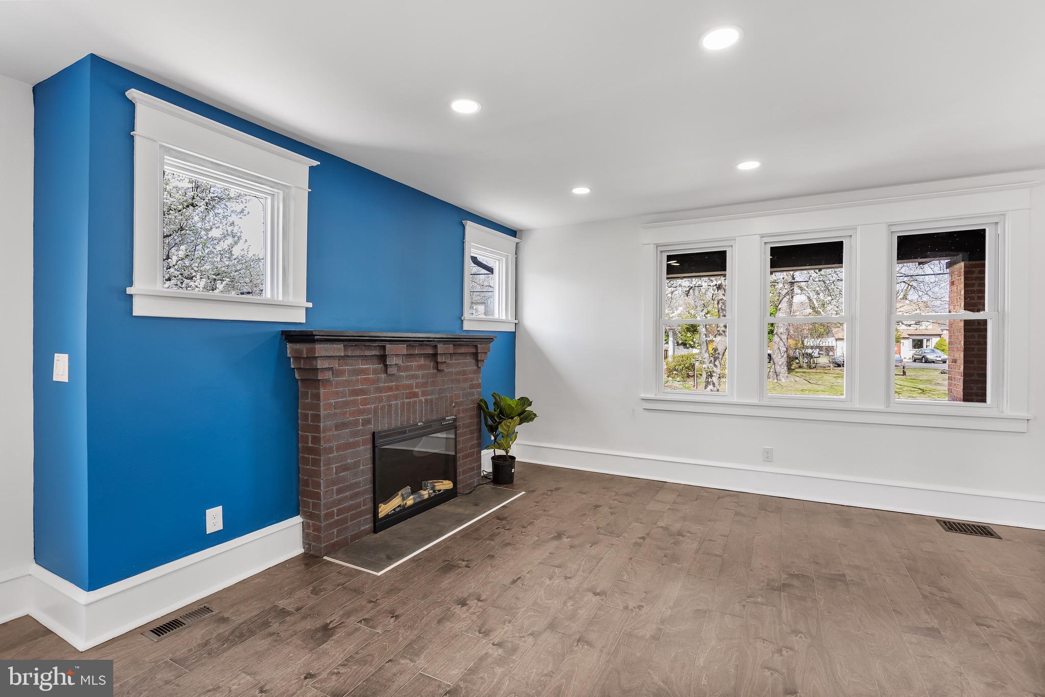 1013 Stone Road Laurel Springs, NJ 08021 - Photo 8 of 42 a view of an empty room with window and fire place