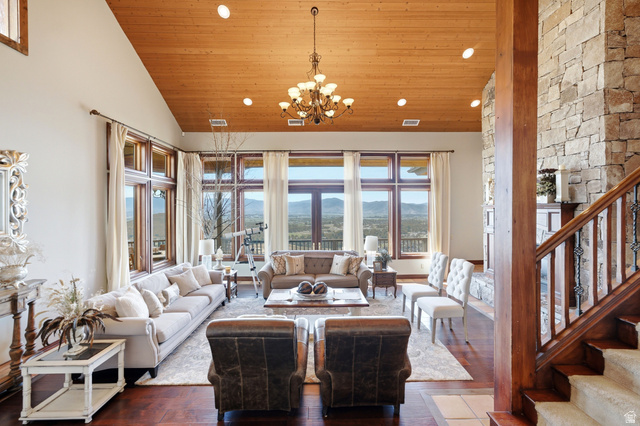 335 Bern Way Midway, UT 84049 - Photo 3 of 88 Expansive living area with a vaulted wood-paneled ceiling, recessed lighting, and a chandelier