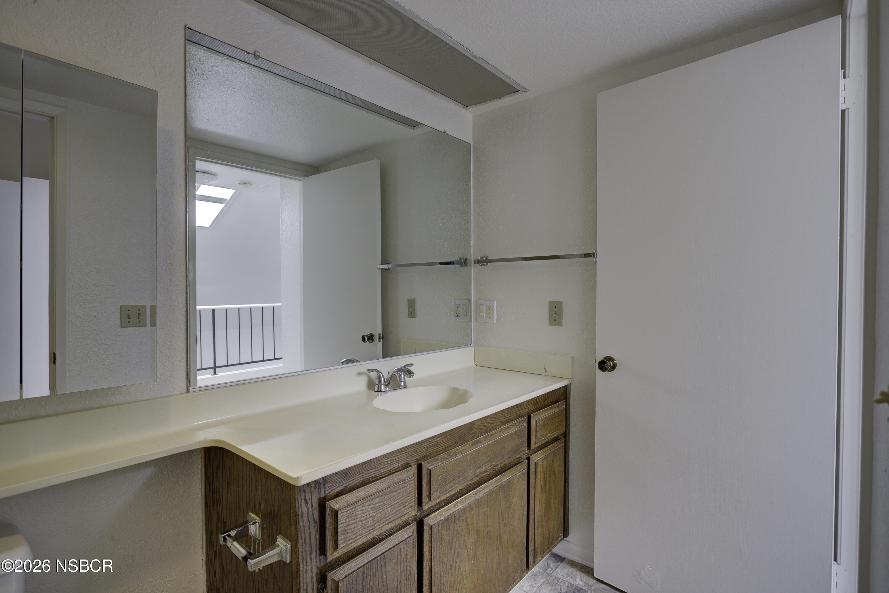 1213 Iris Court Lompoc, CA 93436 - Photo 18 of 21 a bathroom with a sink and a mirror