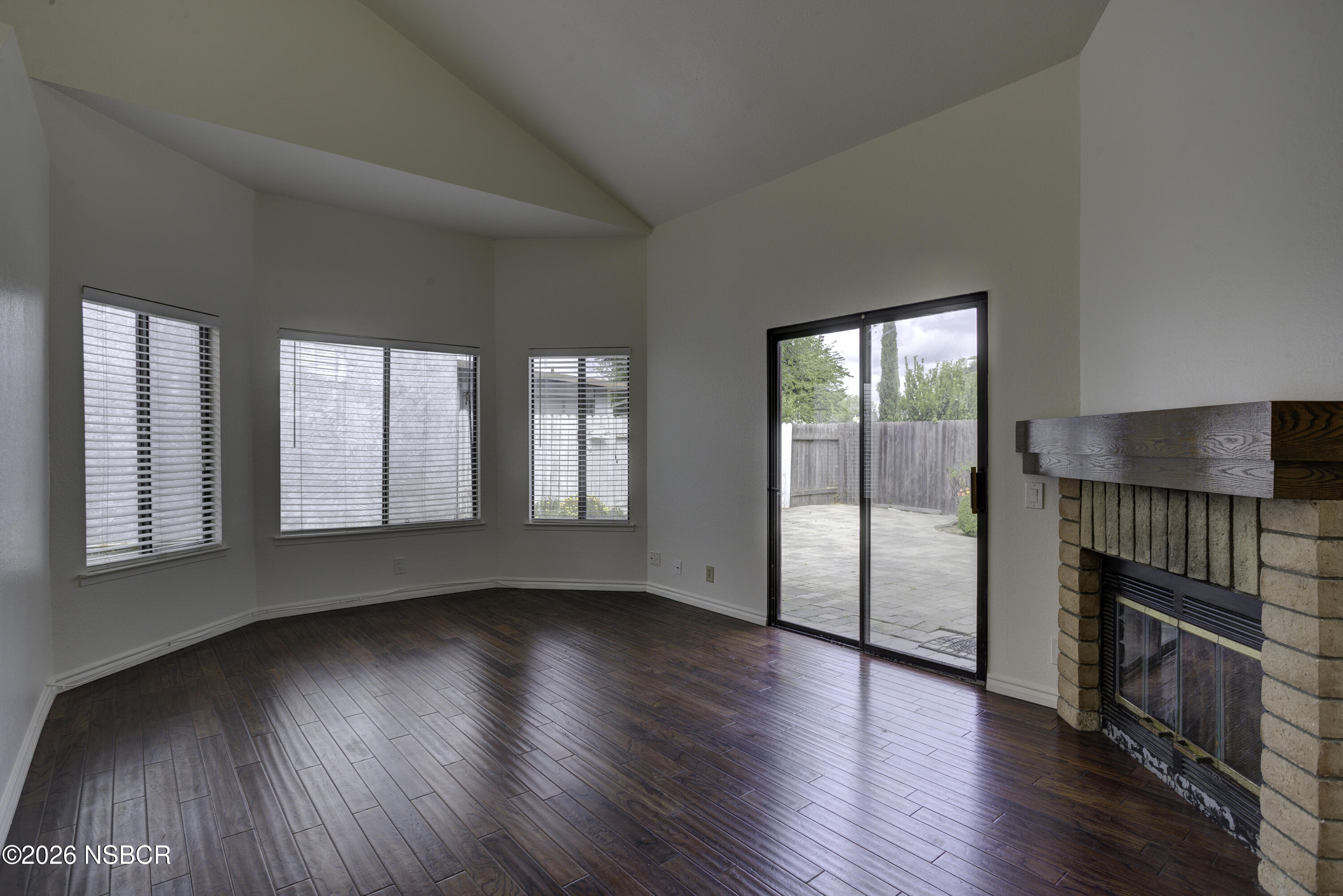 1213 Iris Court Lompoc, CA 93436 - Photo 3 of 21 wooden floor in an empty room with a window