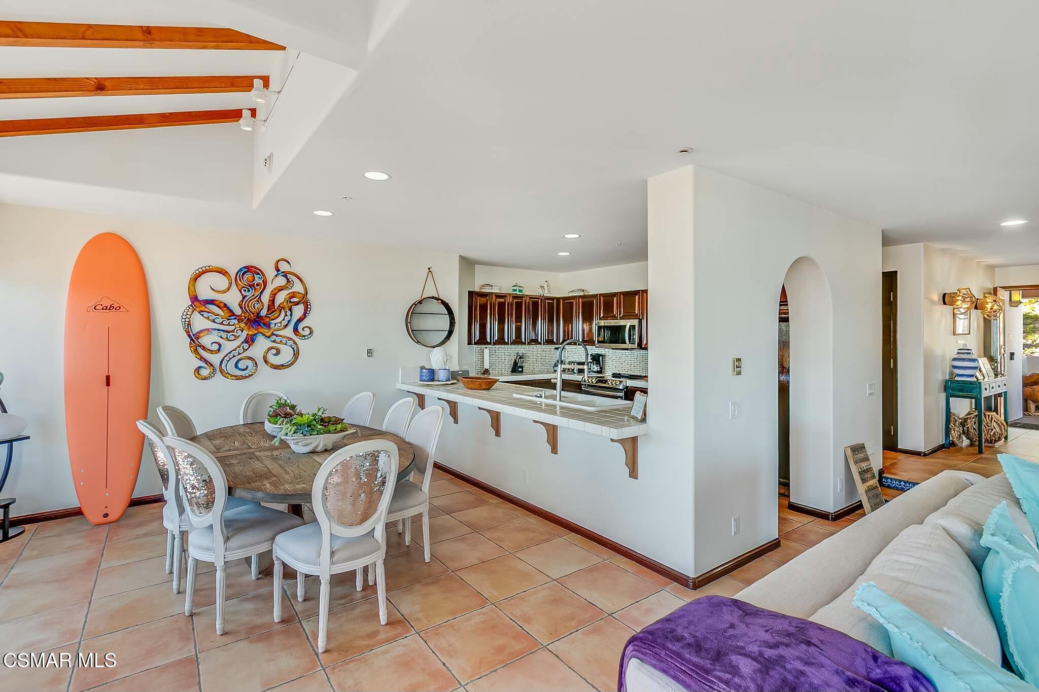 75 Gaviota Avalon, CA 90704 - Photo 16 of 49 a kitchen with stainless steel appliances kitchen island granite countertop a table and chairs