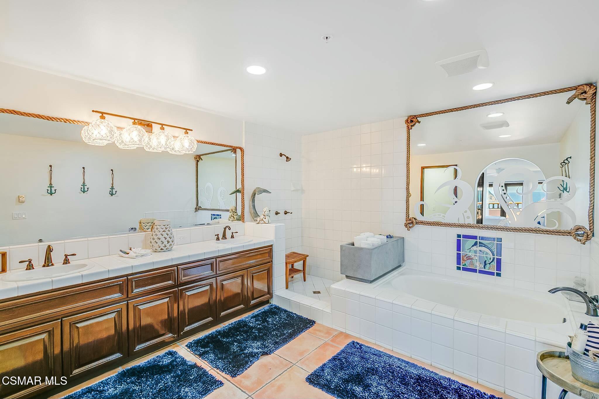 75 Gaviota Avalon, CA 90704 - Photo 27 of 49 a spacious bathroom with a double vanity sink and a mirror