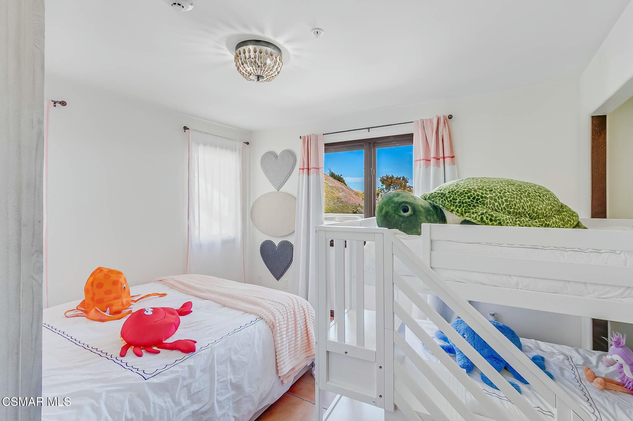 75 Gaviota Avalon, CA 90704 - Photo 33 of 49 a bedroom with a bed and a window