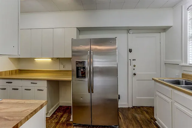 a kitchen with stainless steel appliances cabinets and a counter top space
