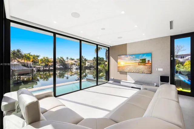 a large bedroom with a large bed and a large window