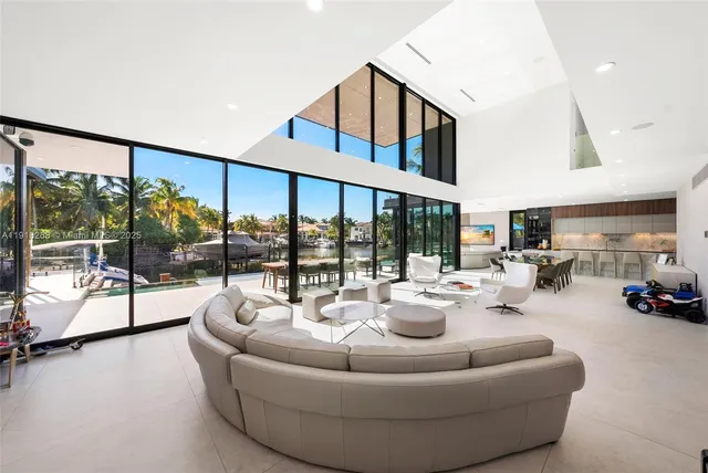 a living room with furniture and a mirror